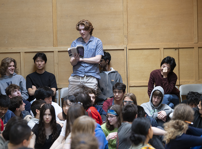 Student speaking at assembly